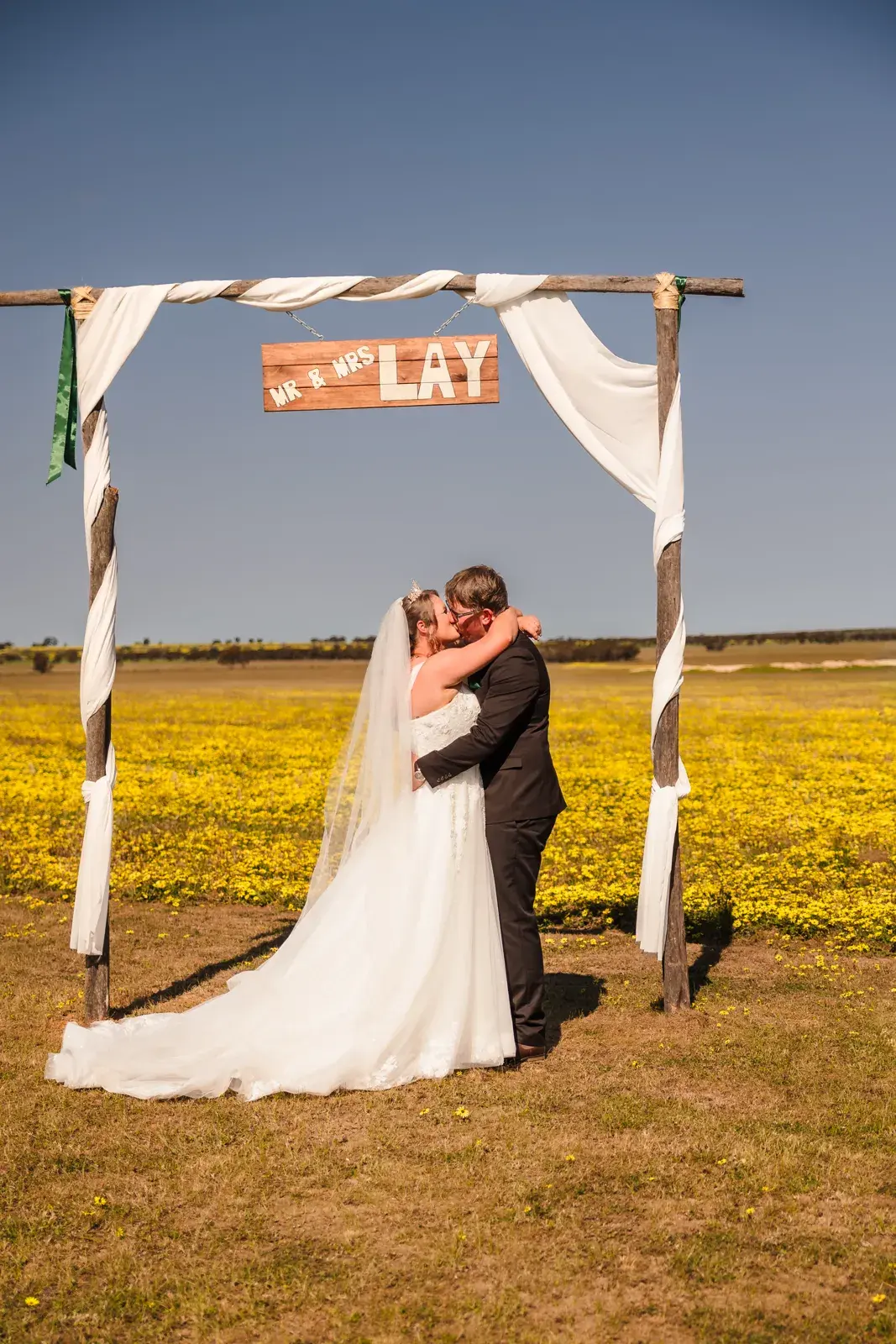 Courtney and Jason's first kiss under the arbour