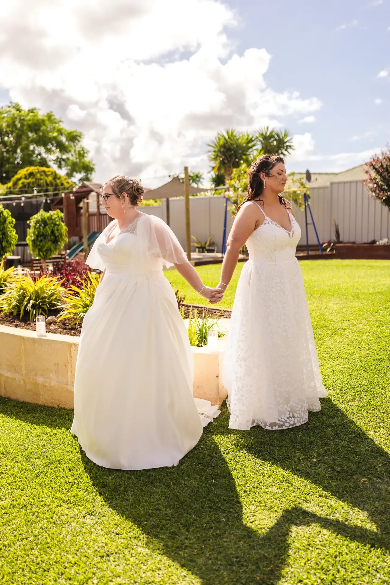 Kat and Jess sharing a first look in their backyard before the wedding