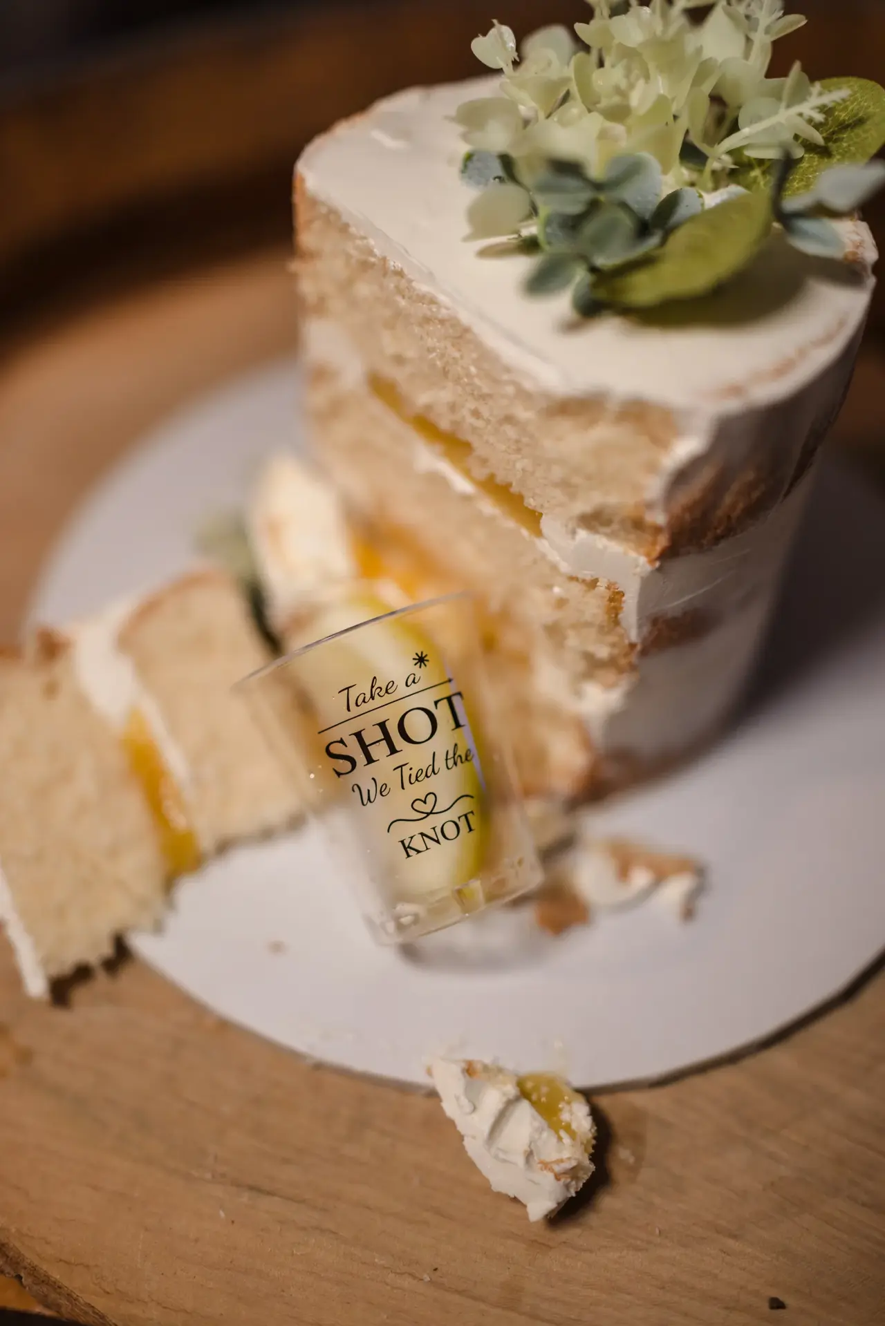 The wedding cake with eucalyptus at Kat and Jess's reception