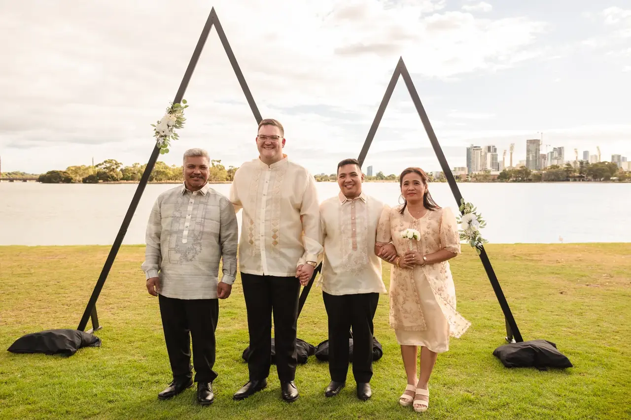 Lloyd and Mitch with their wedding party by the Swan River at Burswood on Swan