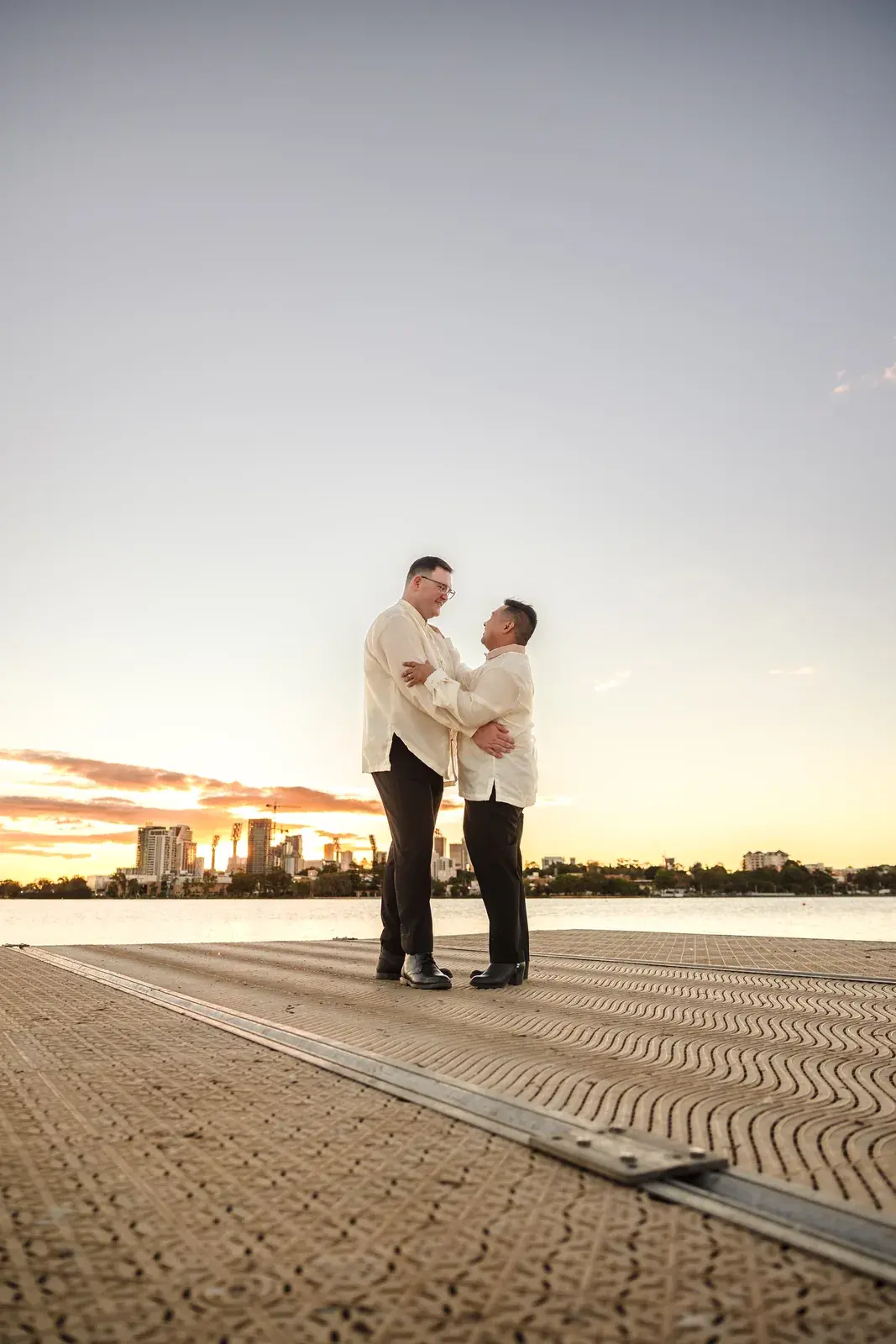 Lloyd and Mitch on the jetty at sunset over the Swan River at Burswood on Swan