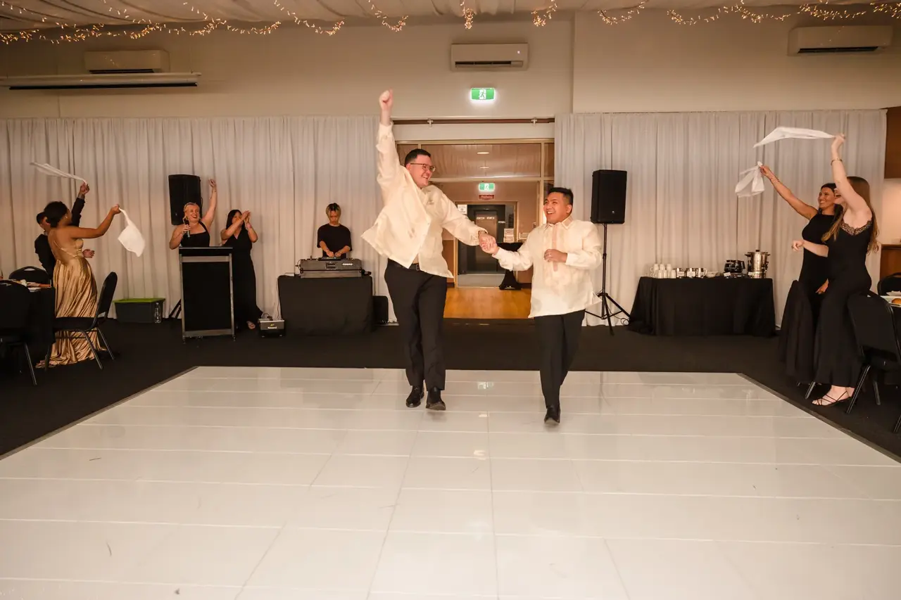 Lloyd and Mitch make their reception entrance to cheering guests at Burswood on Swan