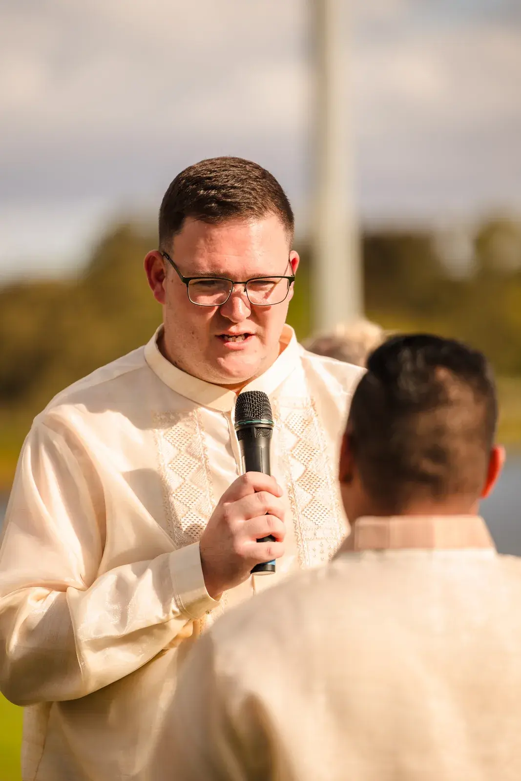 Mitch reading his vows at the riverside ceremony at Burswood on Swan