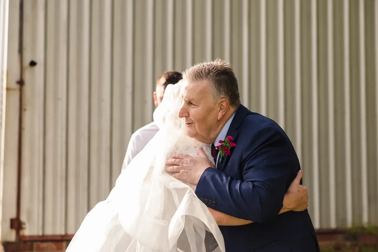 Sarah's dad hugs her tightly after their first look at Quarry Farm