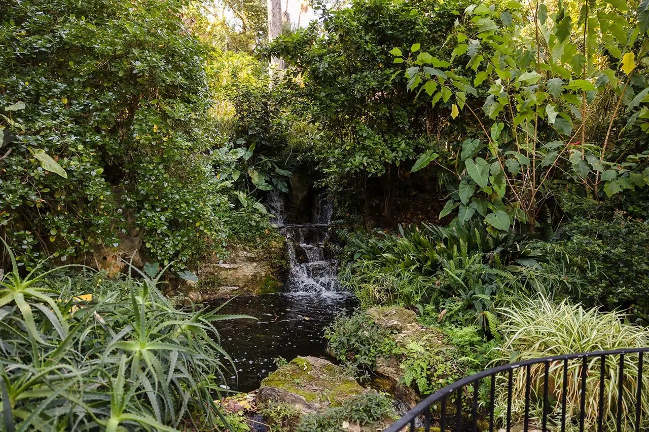 A garden waterfall tucked into the greenery at Wanneroo Botanic Gardens