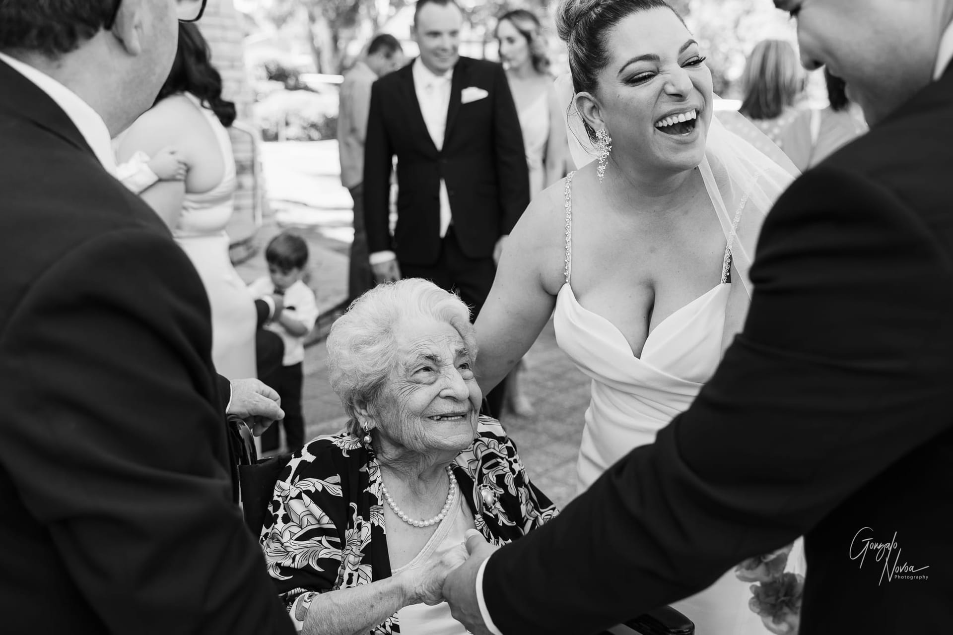 Black and white image of a bride and her 93 yo grandmother after the reception
