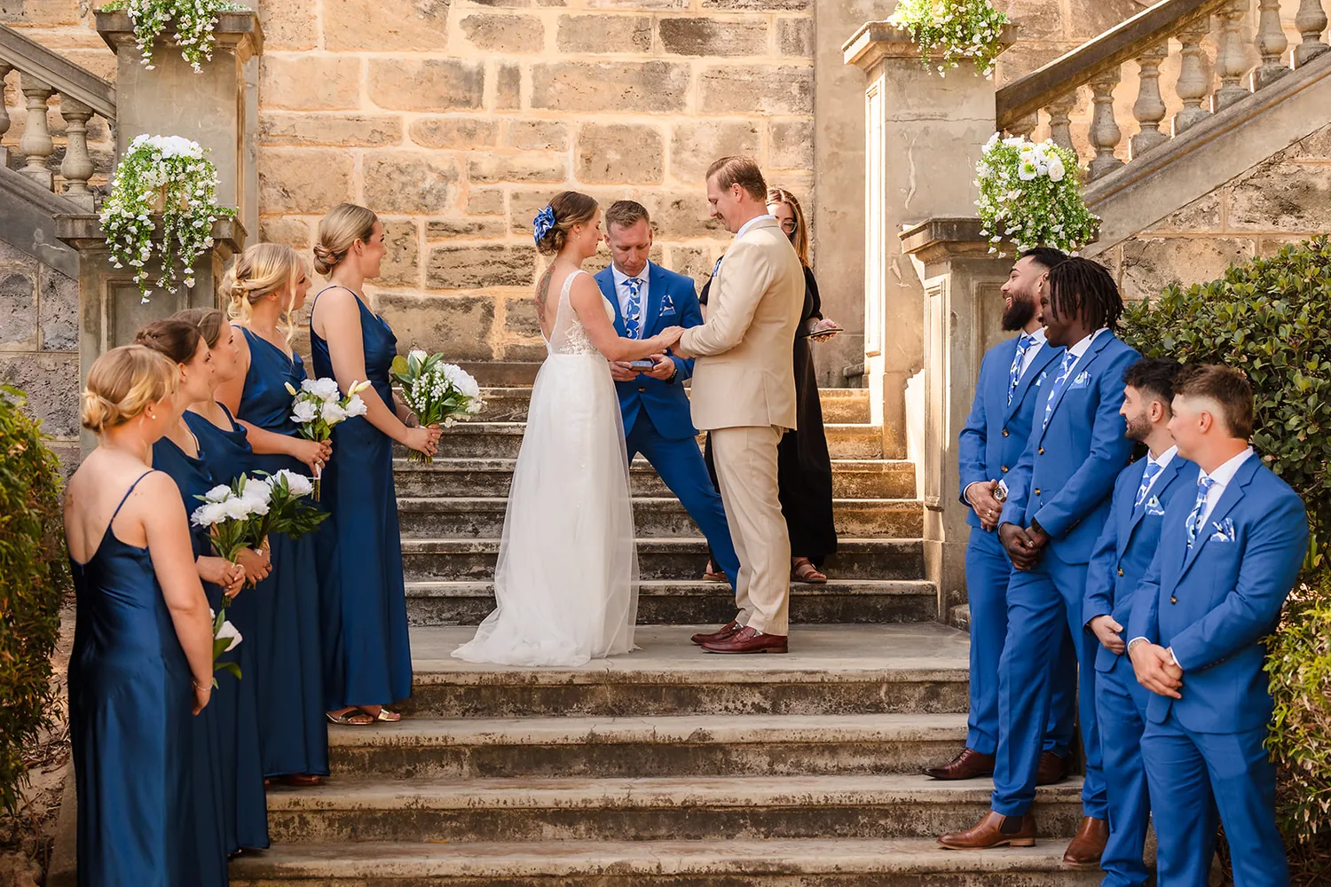 The bridal party on the steps after the ceremony