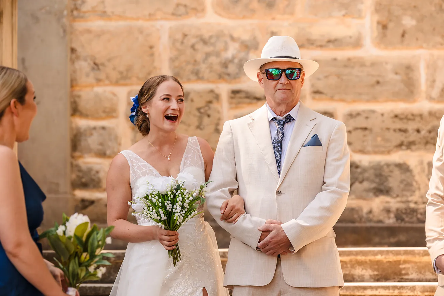 Bride walking down the limestone staircase with her dad at Cottesloe Civic Centre