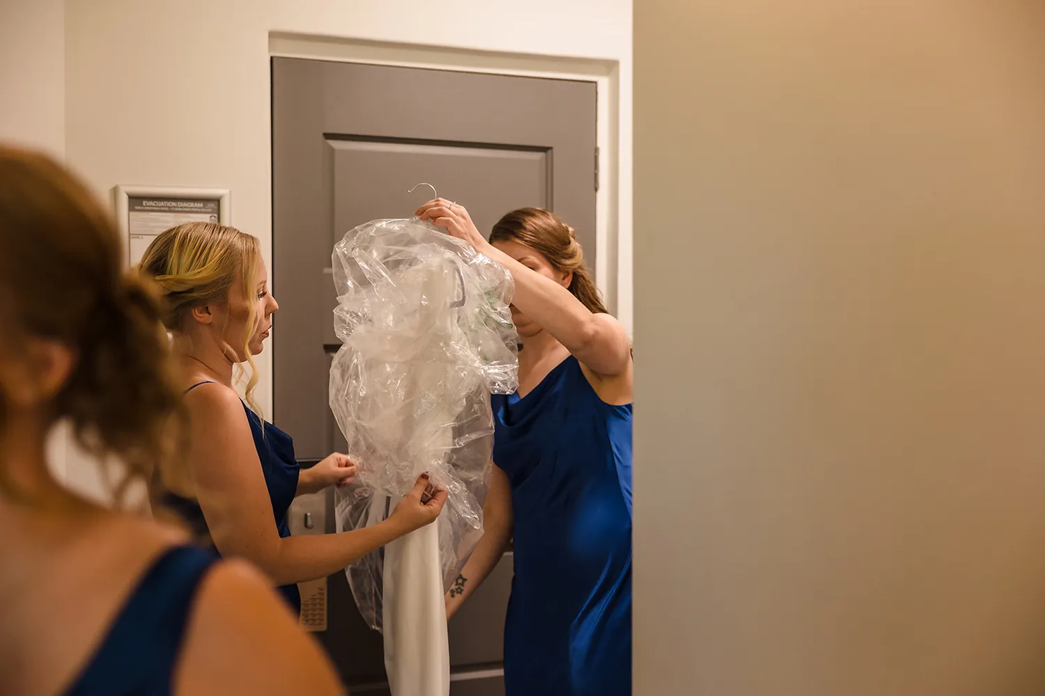 The bride getting into her wedding dress