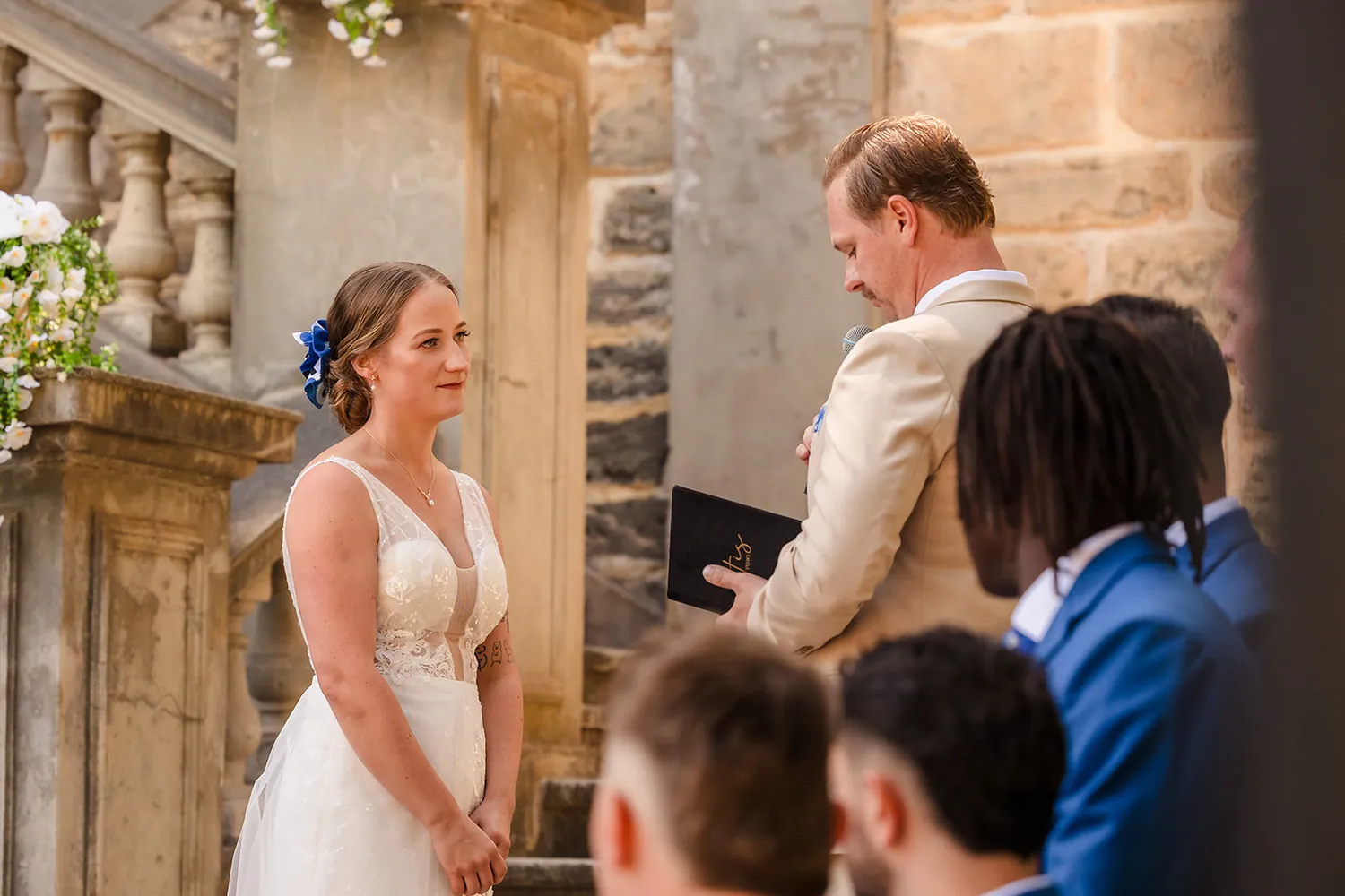 Bride and groom share a kiss on the limestone steps at Cottesloe Civic Centre