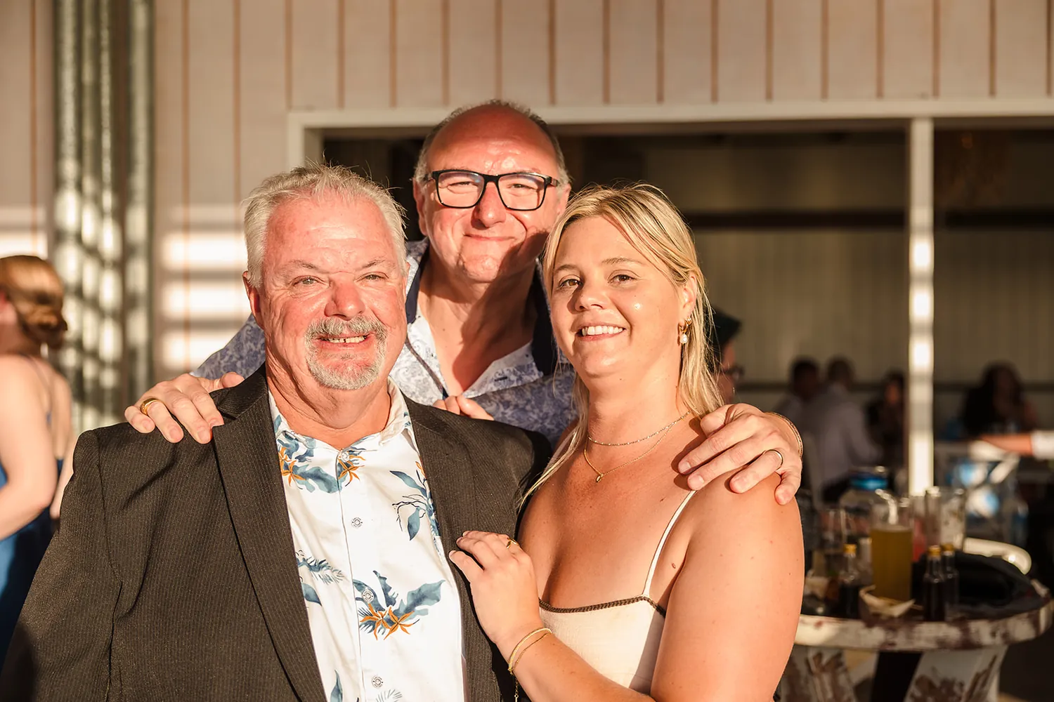 A warm family moment at golden hour at COAST Port Beach