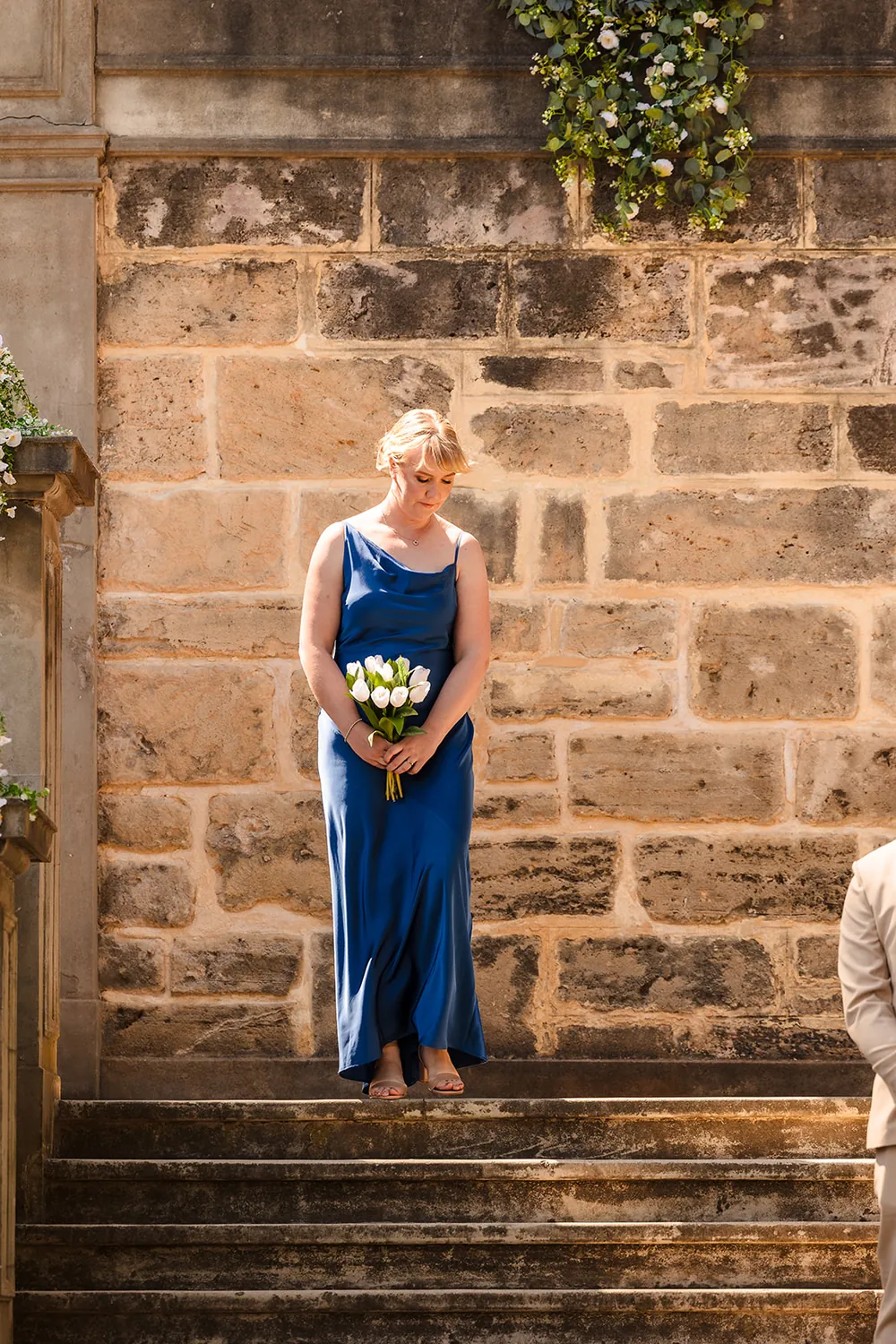 Stone balustrade dressed with white flowers at Cottesloe Civic Centre