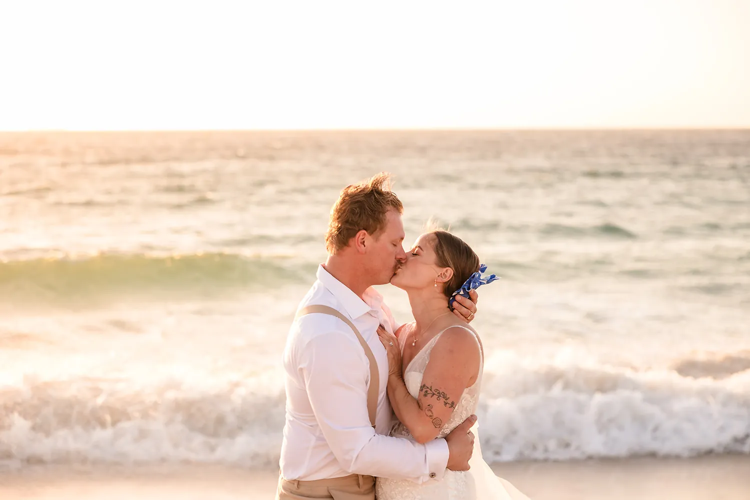 Jaana and Andy sharing a quiet moment on the sand at Port Beach
