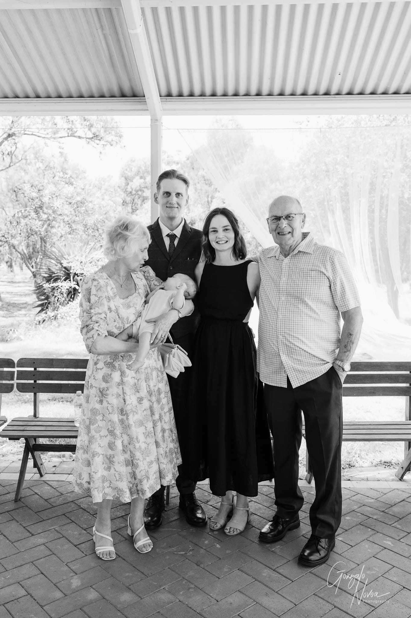 A classic wedding group photo capturing the love and support of family and friends.