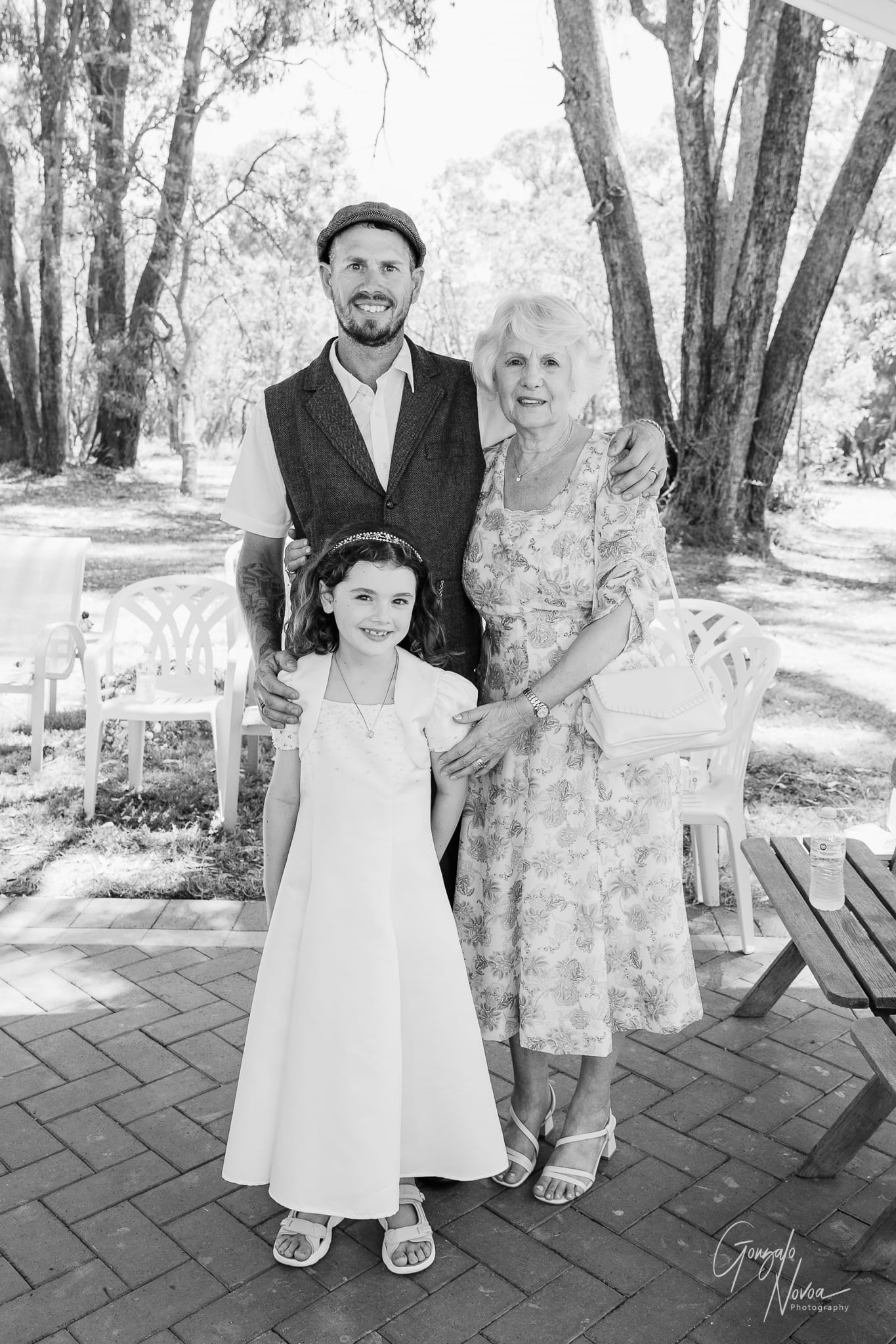 A classic wedding group photo capturing the love and support of family and friends.