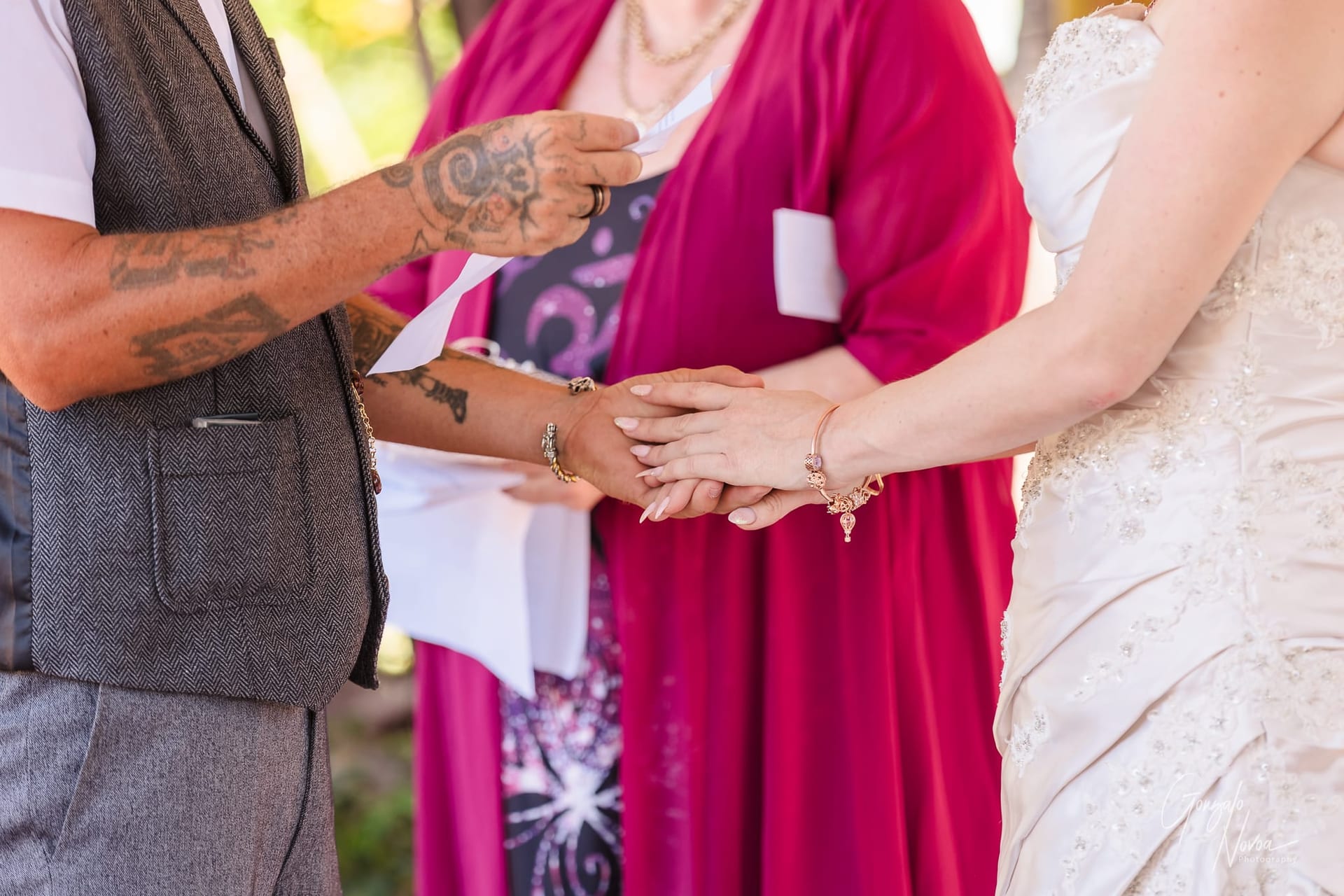 Karissa  and Josh holding hands during the ceremony