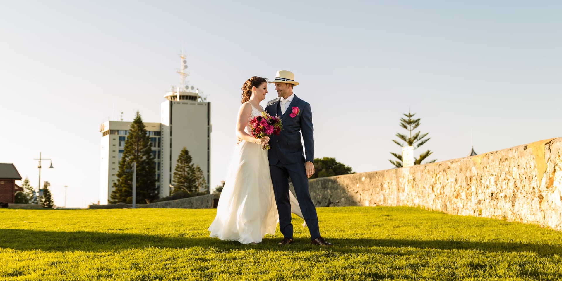 Erin and Geordie are standing on Fremantle Hill overlooking the harbour.