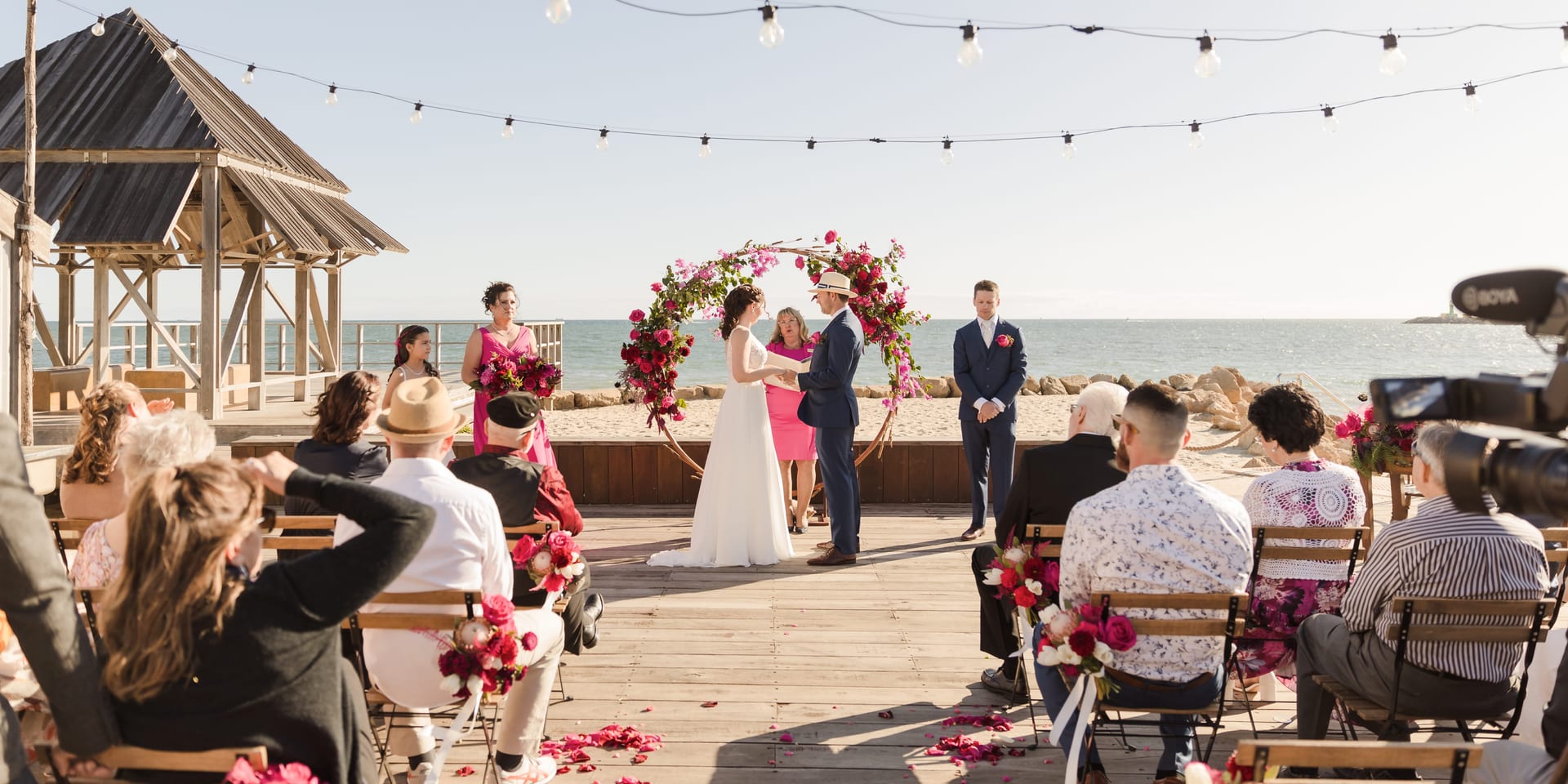 Wide view of beachside wedding ceremony at Kidogo Arthouse Fremantle.