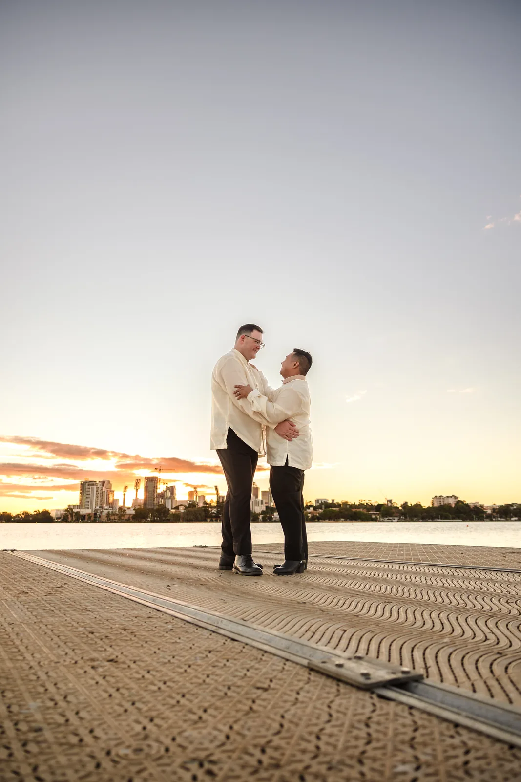 Lloyd and Mitch on the jetty at sunset over the Swan River at Burswood on Swan