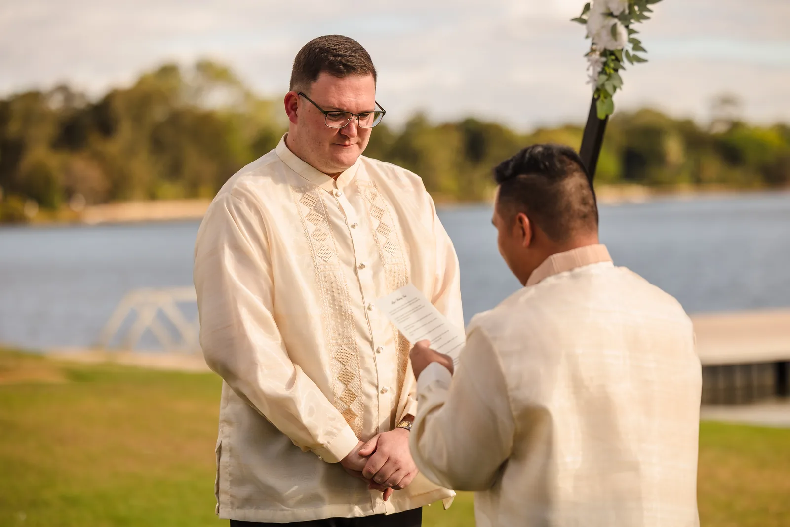Lloyd reading his vows at the riverside ceremony at Burswood on Swan
