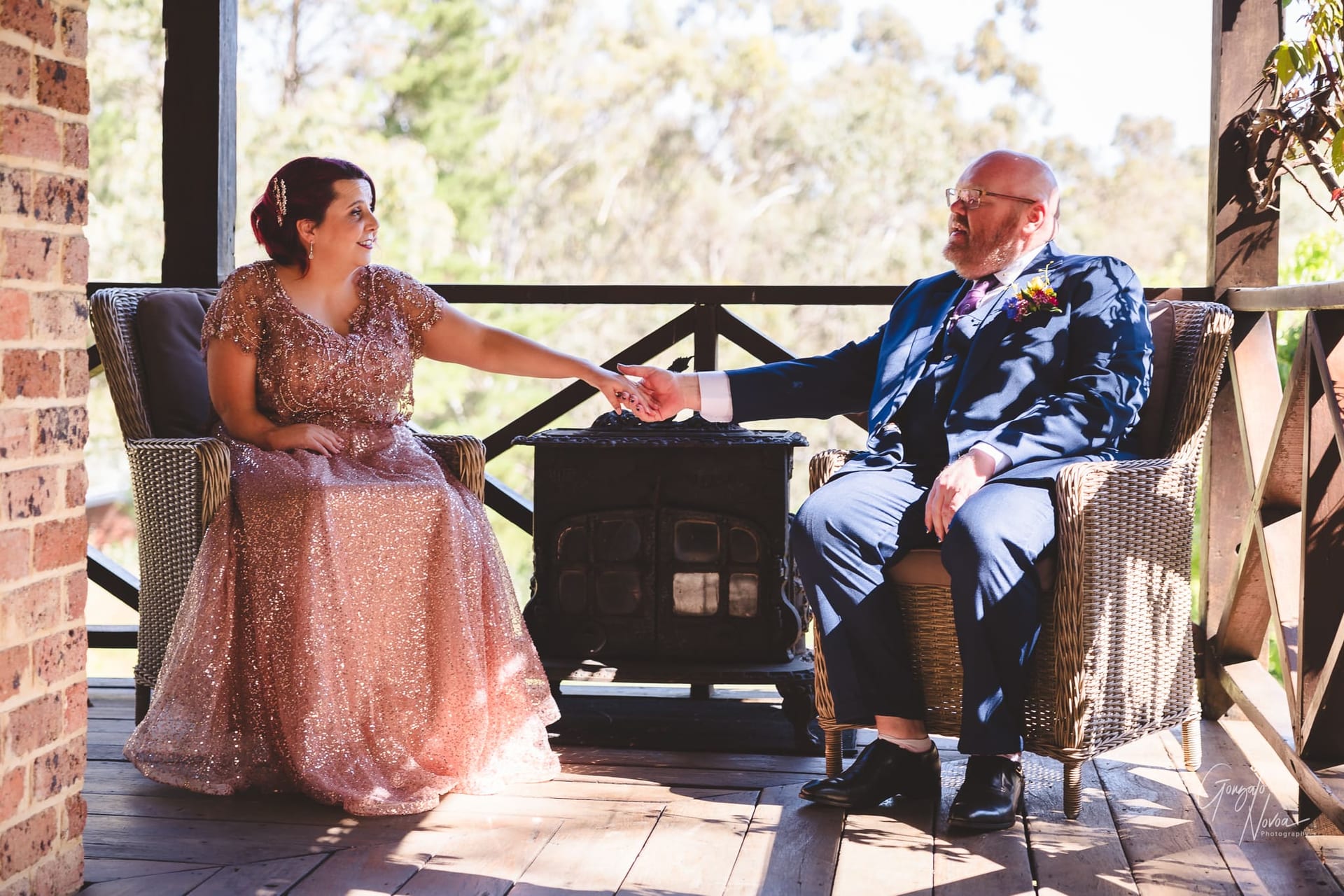 The calm before the ceremony! Bride an groom take a seat and hold hands at the balcony