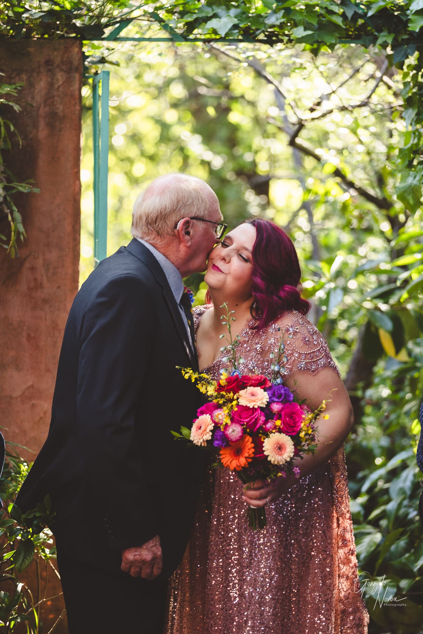 Father and Daughter! The father of the bride kisses his daughter as he's about to walk her down the aisle