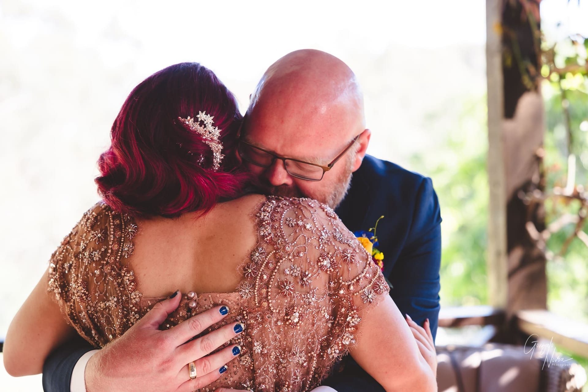Fist look magic! The groom hugs his bride almost unable to contain his happiness!