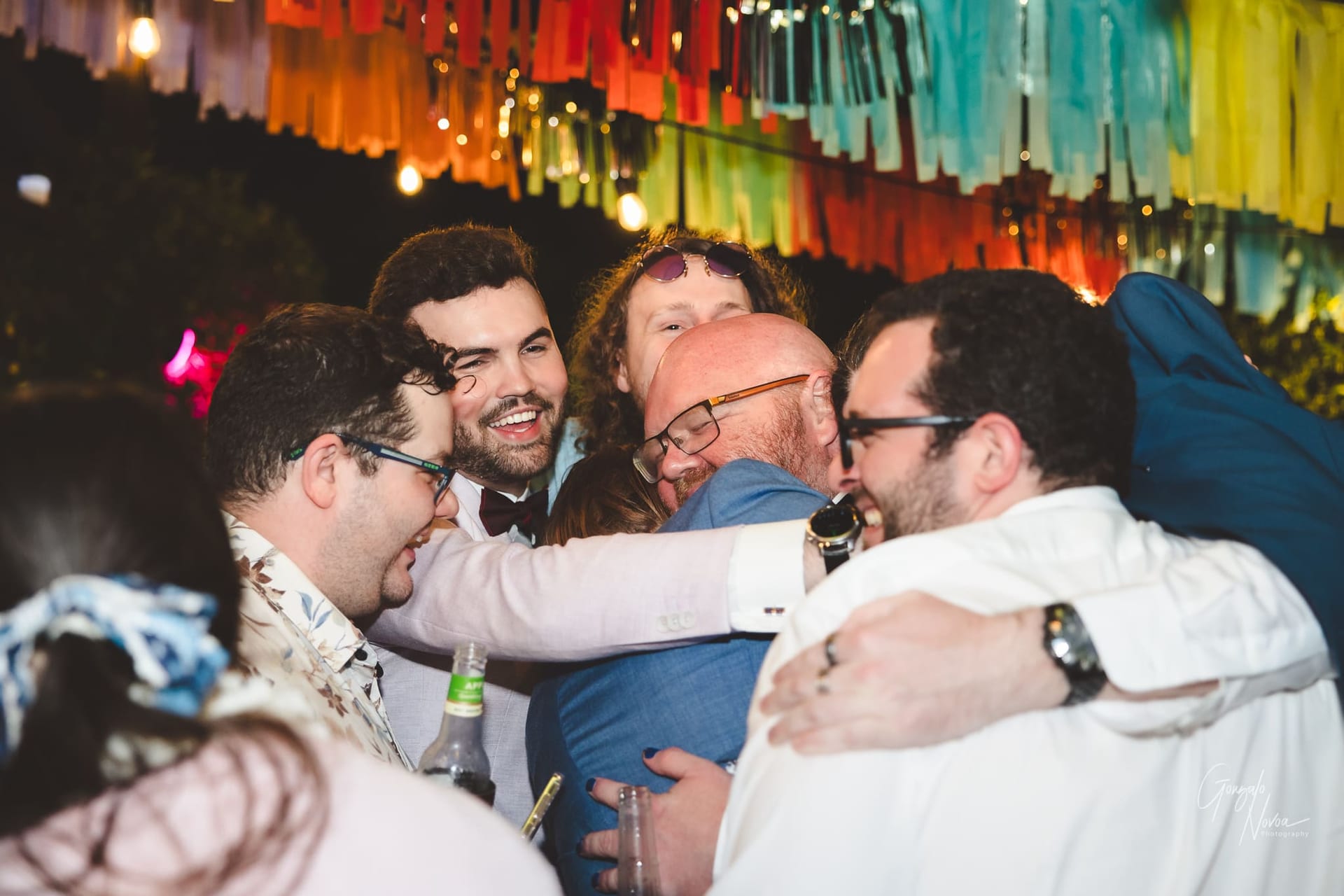 Friends hugging the groom!