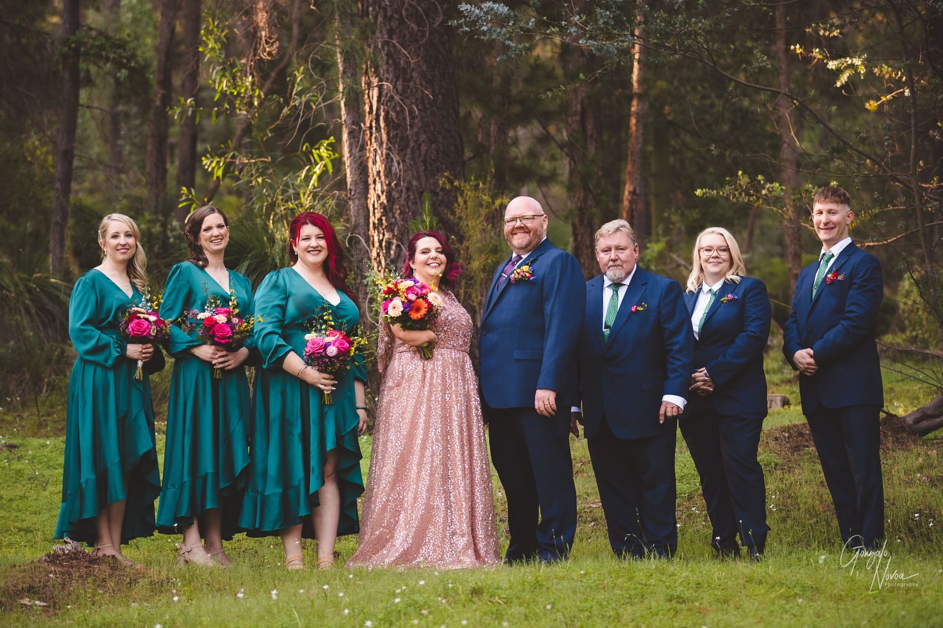 A joyful wedding celebration taking place amidst the serene beauty of a woodland setting.