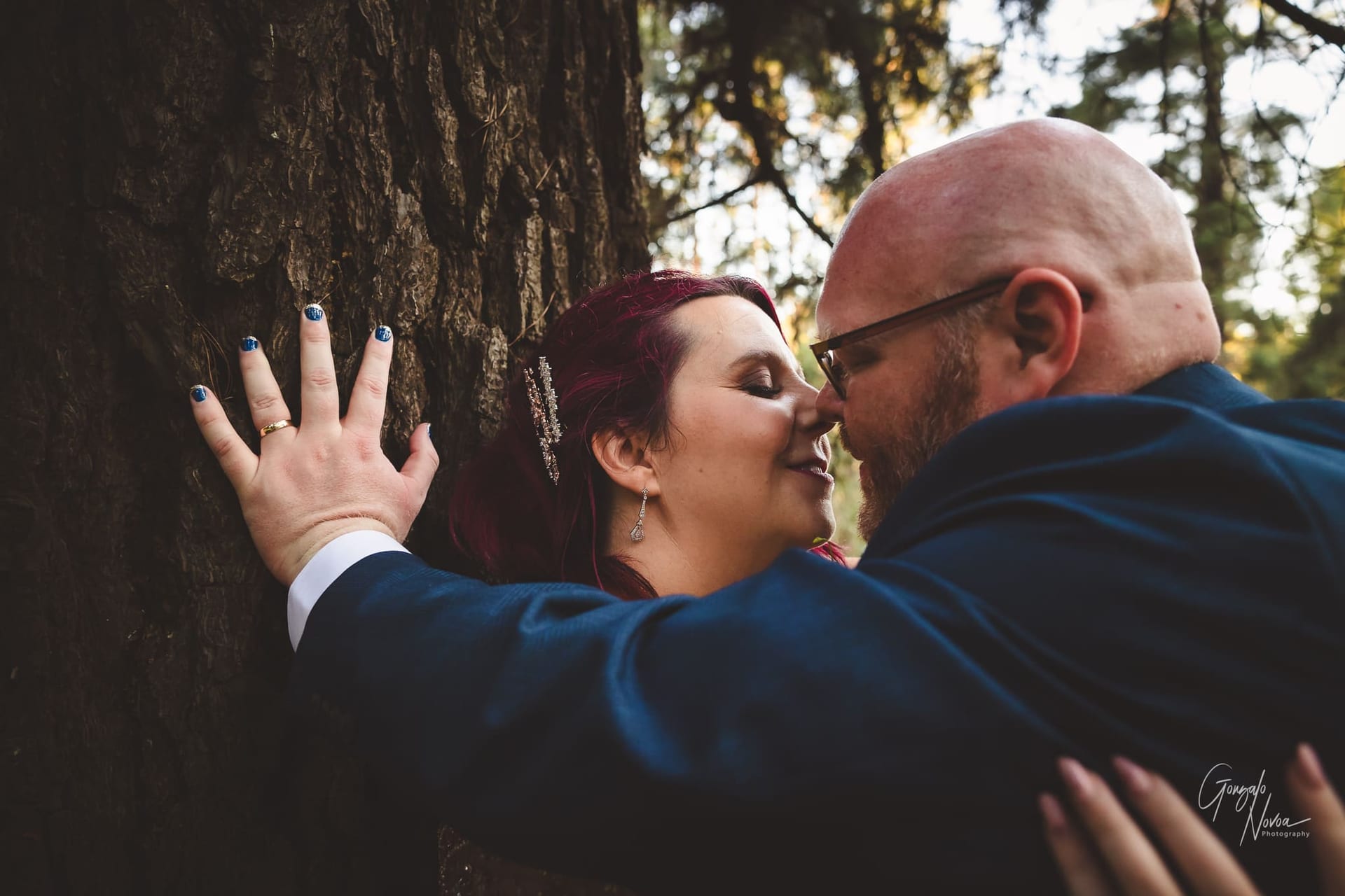 Romance in the woods! Sophie and Bradford snuggling against a massive tree!