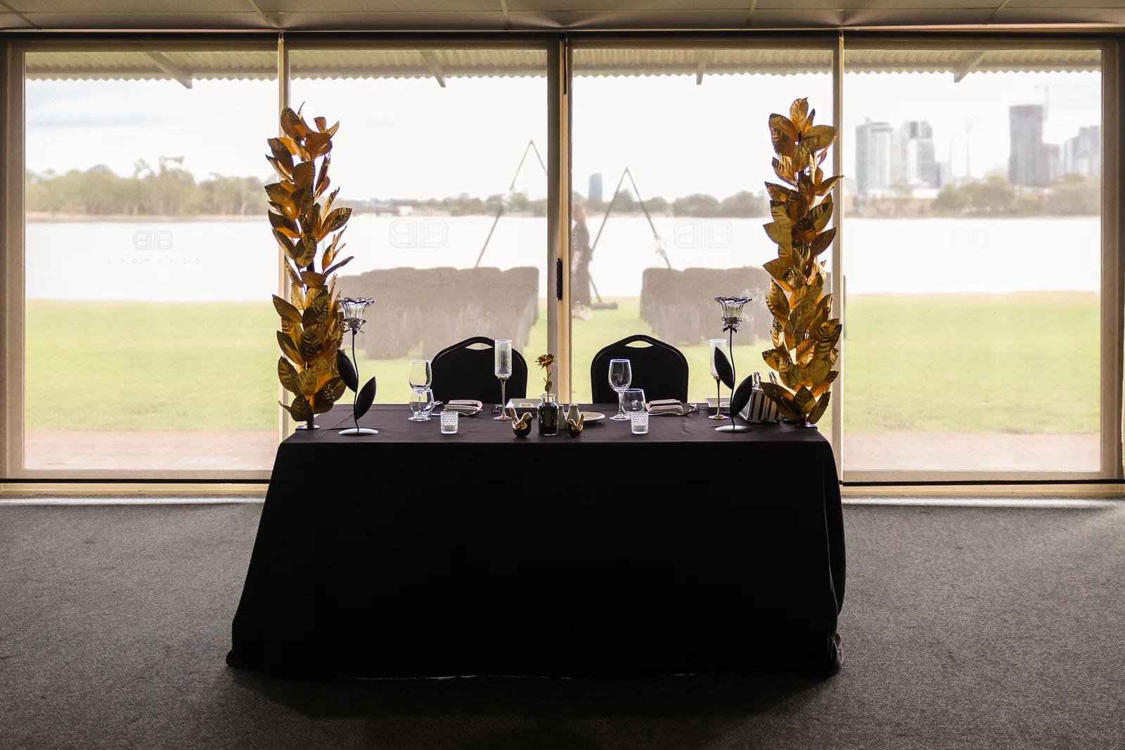 The Perth city skyline across the Swan River seen through the reception windows at Burswood on Swan
