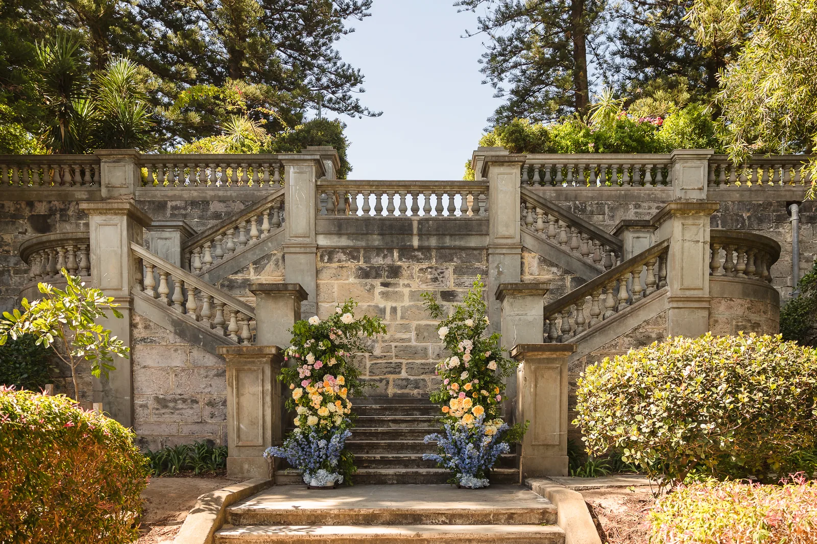 The grand limestone staircase dressed with florals at Cottesloe Civic Centre
