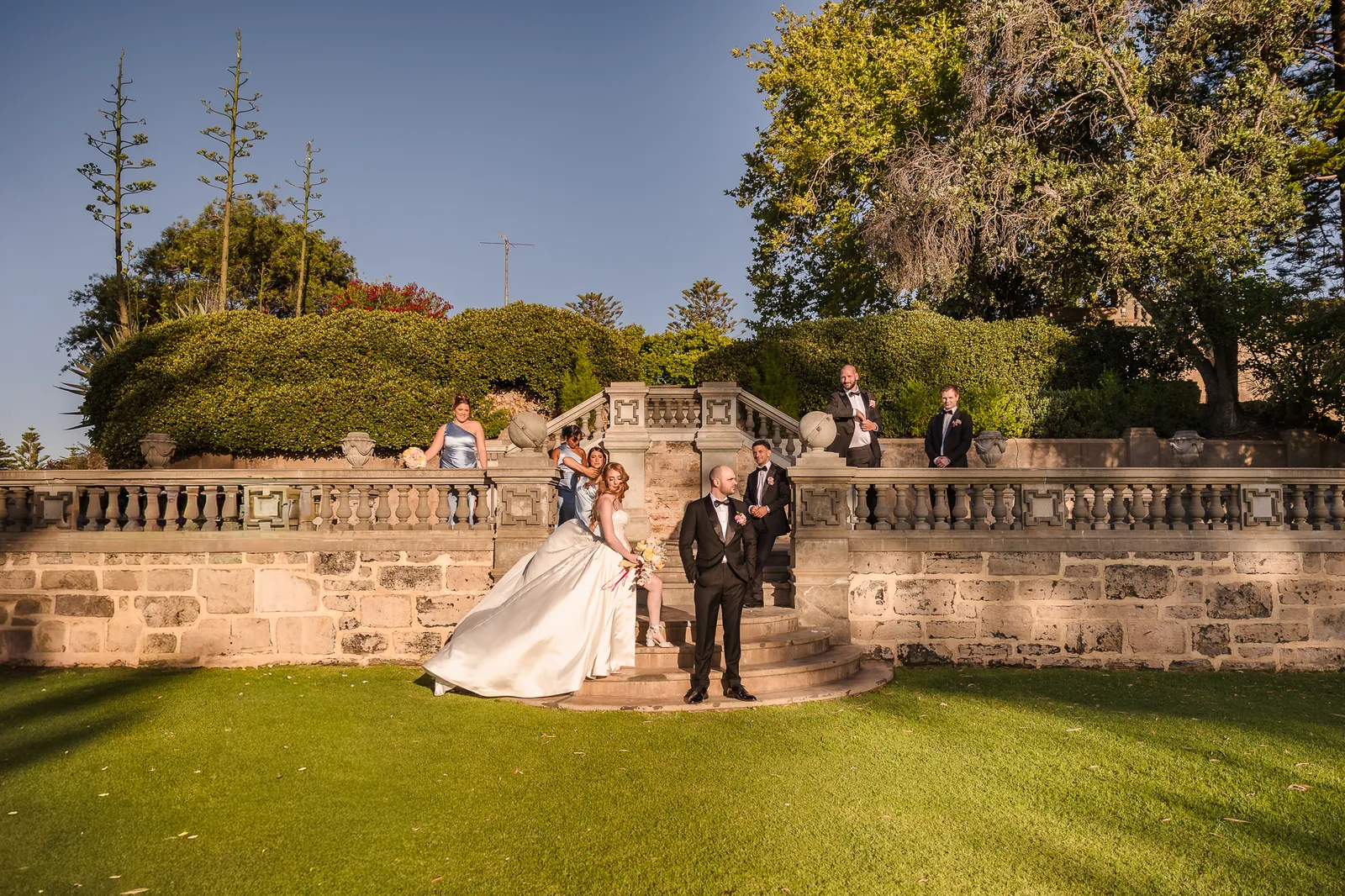 Couple in the pine-lined grounds at Cottesloe Civic Centre